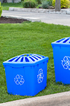 Blue recycle bins at the curb photographed for an ad for Penninsula Plastics by St. Catharines Photographer Yungblut